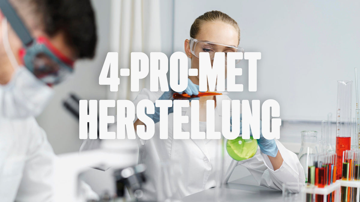 A woman in a lab pouring a liquid from one test tube in another